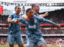 Leon Bailey of Aston Villa celebrates with team mates John McGinn and Youri Tielemans after opening the scoring during the Premier League match between Arsenal FC and Aston Villa at Emirates Stadium.