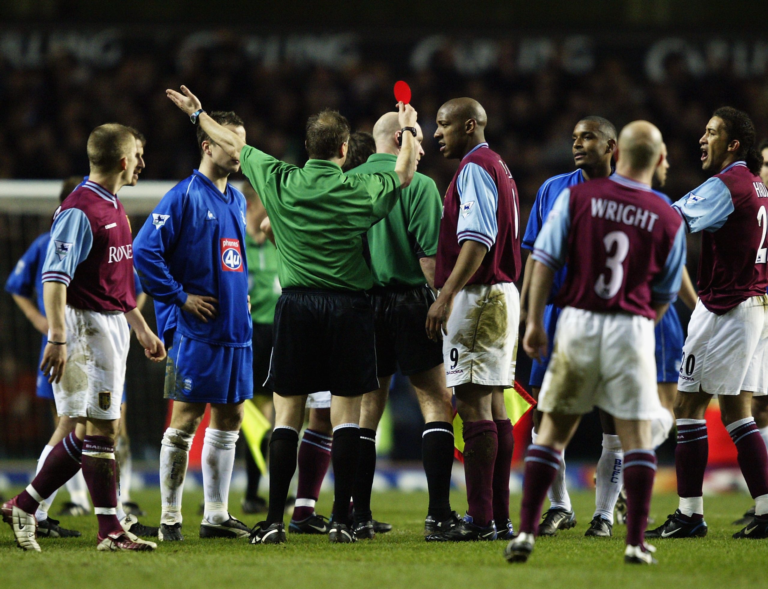 Dion Dublin of Aston Villa is shown the red card by referee Mark Halsey for head butting Robbie Savage of Birmingham City during the FA Barclaycard Premiership match held on March 3, 2003 at Villa Park.