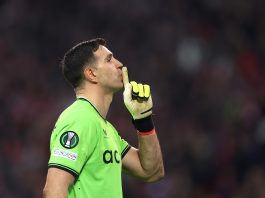 Emiliano Martinez of Aston Villa gestures towards the Lille fans during the penalty shoot-out during the UEFA Europa Conference League 2023/24 Quarter-final second leg match between Lille OSC and Aston Villa at Stade Pierre-Mauroy.